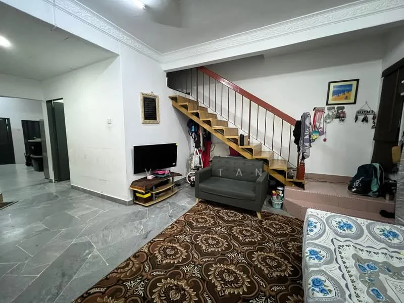 Living features: grey fabric sofa, coffee table, wall-mounted TV, decorative wall art, area rug with geometric pattern, staircase with wooden steps, white painted walls, ceiling with crown moulding, marble tile flooring; style: modern. Room features: open space with access to staircase, dark wood railing, light fixture on ceiling.