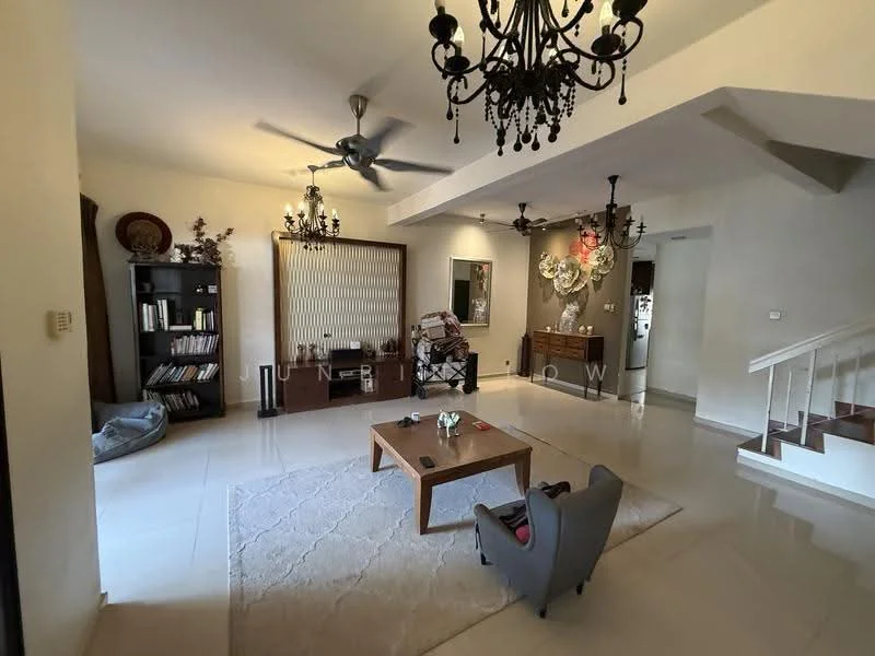 Living features: cream painted walls, polished tile flooring, 5-blade ceiling fan with light, chandelier, 2 wall-mounted sconces, wooden bookshelf, decorative wall art, coffee table, area rug with geometric pattern, upholstered armchair in grey, decorative plants, staircase with wooden railing; style: contemporary.