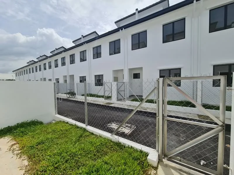 Exterior type: linked terrace house; features: white painted facade, two-storey building, flat roof, multiple windows, fenced perimeter, manicured lawn, paved walkway, bicycle visible, gated entry; style: modern.