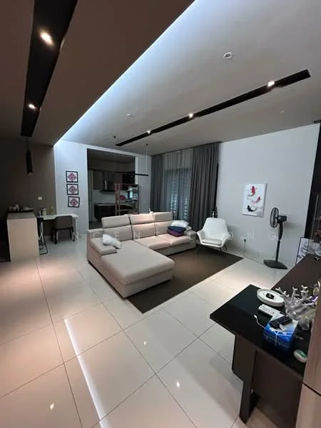 Living features: L-shape sectional sofa in light beige, area rug in dark brown, coffee table, wall-mounted TV, freestanding fan, recessed LED downlights, floor-to-ceiling windows with sheer curtains, decorative wall art, open-plan layout to kitchen, grey accent wall, white painted walls, polished ceramic tile flooring; style: modern. Kitchen features: kitchen island, stainless-steel appliances, dark cabinetry, open shelving, recessed lighting; style: modern.