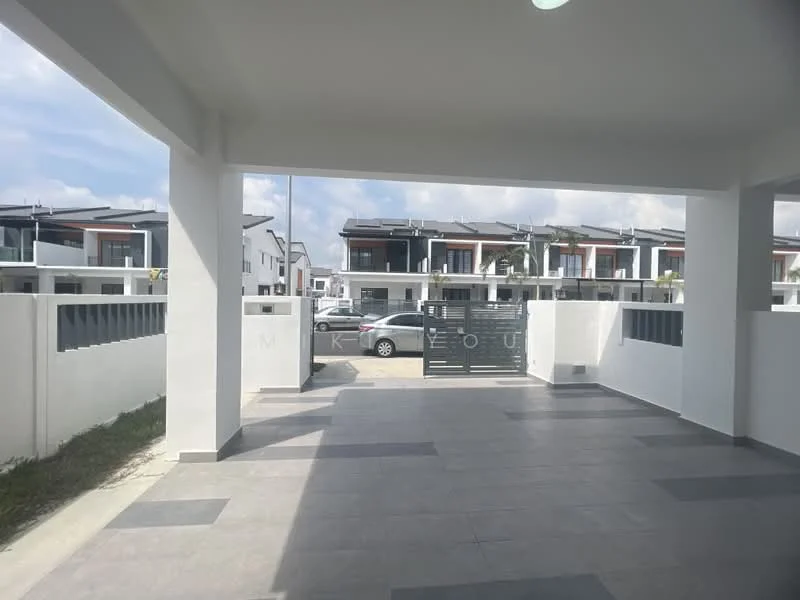 Exterior type: linked terrace house; features: white painted facade, flat roof, approximately 2-storey, manicured lawn, paved driveway, gated entrance, surrounded by residential buildings, concrete fence, sliding gate, parking space for multiple cars; style: modern.