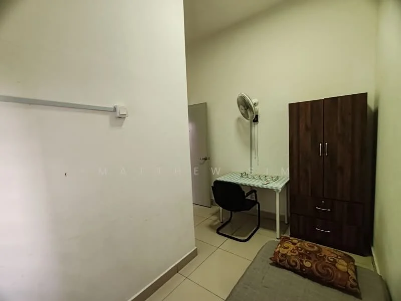 Room features: white painted walls, tile flooring, ceiling fan, wooden wardrobe, study desk, black office chair, single bed, decorative cushion; style: minimalist.