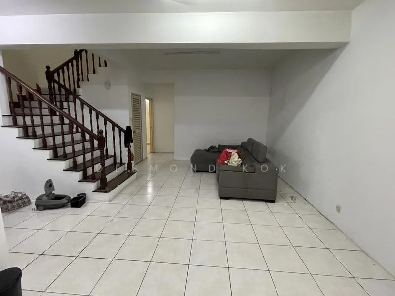 Living features: white painted walls, tile flooring, staircase with wooden railing, grey fabric sectional sofa, area rug, floor space for furniture arrangement, doorway leading to other rooms, pet area with feeding bowls.