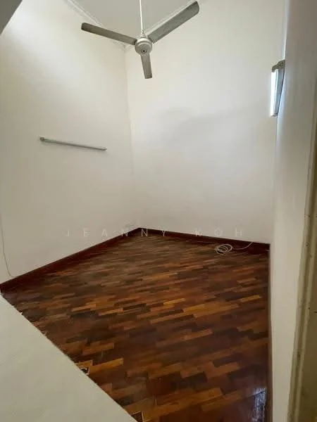 Room features: wooden flooring, white painted walls, ceiling fan, small window, baseboard, light fixture, power outlet.