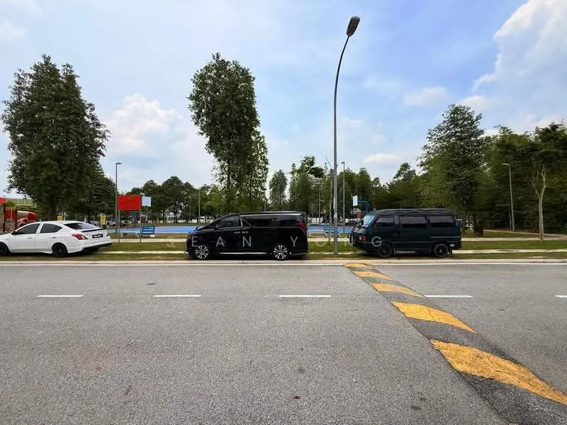 Exterior type: landscape garden; features: manicured lawn, mature trees, paved walkway, parking spaces, playground area, surrounding greenery; style: modern.