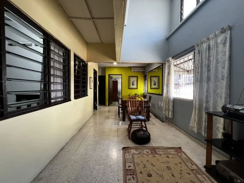 Room features: cream painted walls, grey painted walls, tile flooring, large windows with metal grills, wooden rocking chair, area rug with floral pattern, dining table with chairs, air conditioning unit, decorative wall art, curtains, light ceiling, open layout; style: traditional.
