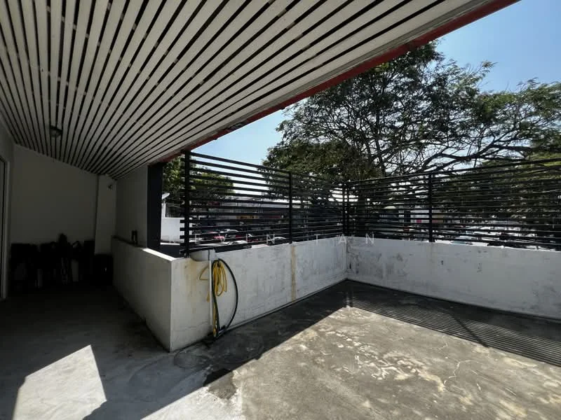 Room features: concrete flooring, horizontal metal railing, exposed ceiling with wooden slats, outdoor space, partial wall, hose connection, trees visible outside, sunlight streaming in; style: modern; view: garden.