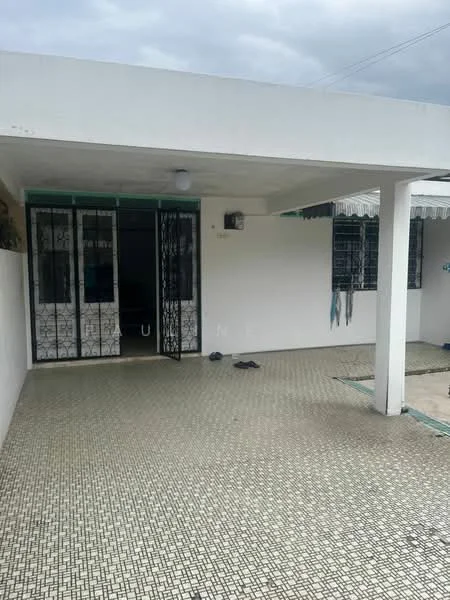 Exterior type: detached bungalow; features: white painted facade, flat roof, covered porch area, grill gate, mosaic tile flooring, exterior wall with windows, outdoor space with no landscaping, overhang for shade; style: modern.