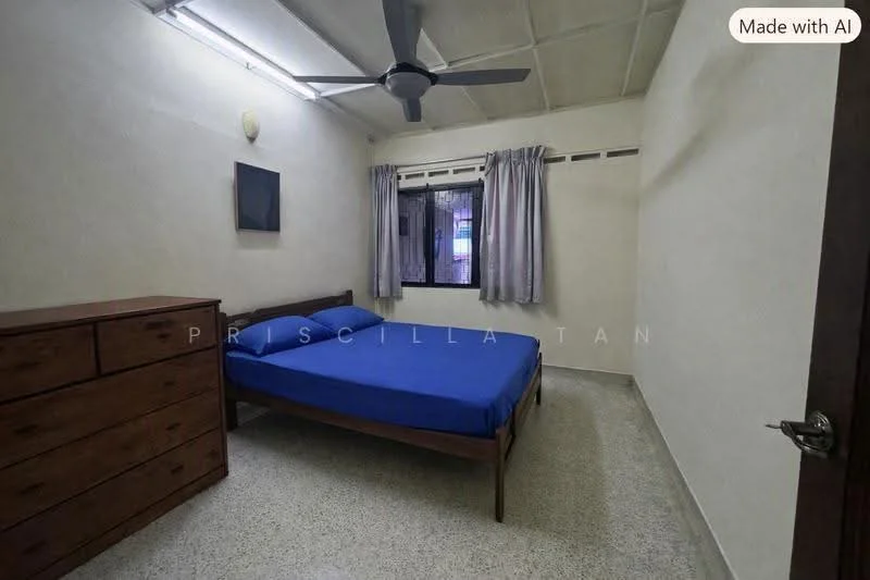 Bedroom features: blue bedspread on double bed, wooden bed frame, wooden dresser, ceiling fan, window with grey curtains, plain white walls, textured ceiling, light-colored flooring; style: minimalist.