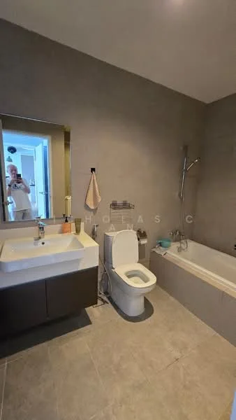 Bathroom features: single-sink vanity with wood cabinet, chrome basin mixer faucet, framed mirror, one-piece toilet, built-in bathtub, handheld shower, tile cladding on walls, ceramic tile flooring, towel rack, light fixture; style: modern.