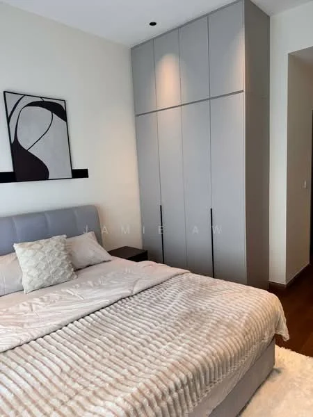 Bedroom features: king-size bed with grey upholstered headboard, plush beige throw blanket, decorative pillows, built-in wardrobe with grey finish, framed artwork on wall, wood flooring, recessed ceiling lights, white painted walls; style: modern.