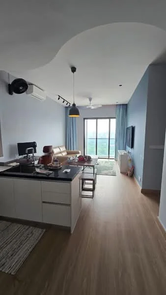 Living features: light wood flooring, blue painted walls, sofa in beige, coffee table, TV console, wall-mounted TV, 5-blade ceiling fan with light, floor-to-ceiling windows, curtains, area rug with geometric pattern, decorative items on table; style: modern; view: city. Kitchen features: white cabinetry, black countertop, stainless-steel sink, chrome pull-down faucet, built-in appliances, kitchen island, bar stools; style: modern.