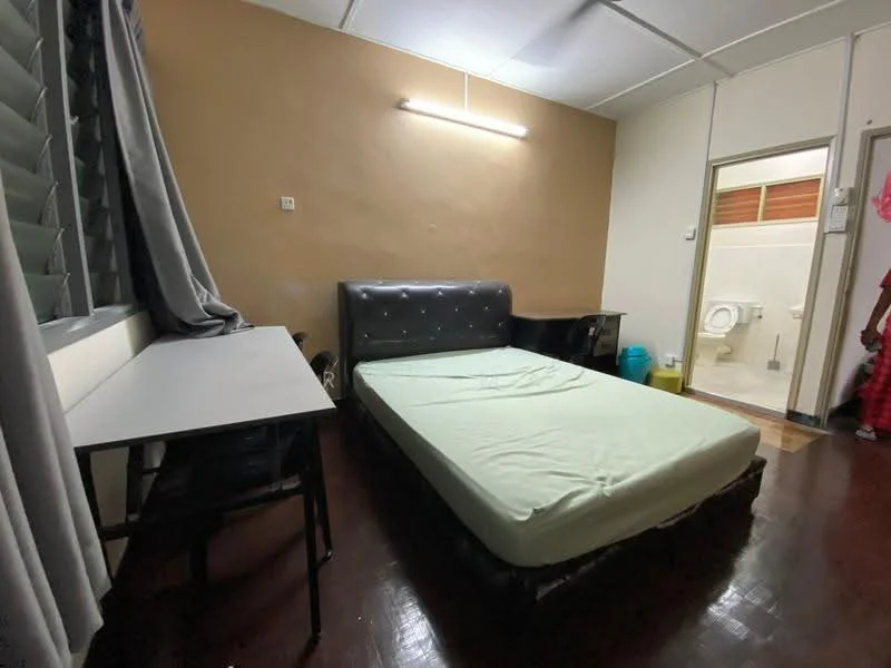 Bedroom features: queen-size bed, upholstered headboard, wooden flooring, desk with chair, curtains, wall-mounted light, painted walls in beige, window with louvered shutters, en-suite bathroom door.
