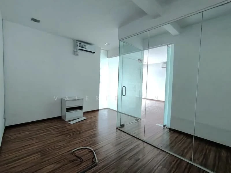 Room features: white painted walls, wooden flooring, 1 wall-mounted split AC, glass partition, ceiling with exposed beams, natural light from windows, baseboard trim, electrical outlet; style: modern.
