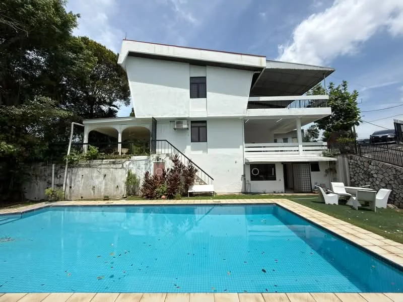 Exterior type: detached bungalow; features: white painted facade, flat roof, approximately 2-storey, swimming pool, pool deck with loungers, manicured lawn, surrounded by mature greenery, outdoor seating area, covered balcony, air conditioning unit visible; style: modern.