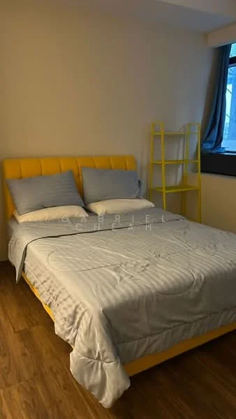 Bedroom features: yellow upholstered headboard, queen-size bed with grey bedding, wooden flooring, yellow bookshelf, window with sheer curtains, light grey walls, decorative pillows; style: modern.