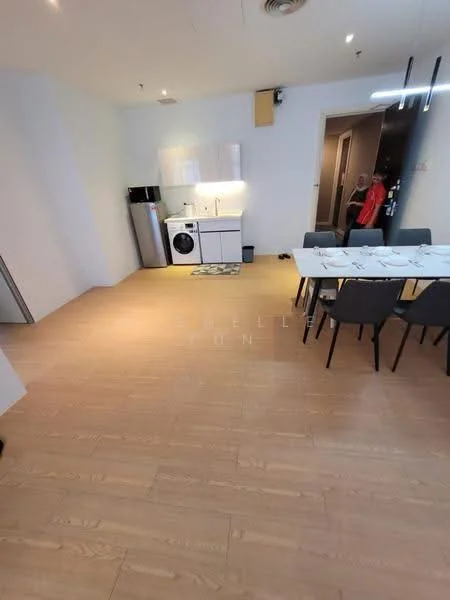 Living features: light wood laminate flooring, white painted walls, kitchenette with white cabinetry, stainless-steel fridge, front-load washing machine, dining table with six chairs, recessed ceiling lights, open layout, wall-mounted TV, large windows, neutral decor; style: modern.