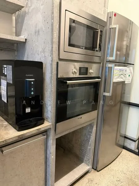 Kitchen features: stainless-steel refrigerator, built-in microwave, built-in oven, black water dispenser, concrete wall, open shelving, grey countertop, cabinetry below countertop; style: modern.