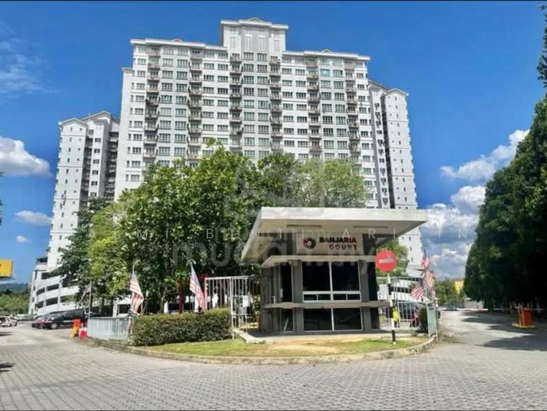 Exterior type: high-rise condominium; features: glass curtain wall, white painted facade, double-volume main lobby, guard house at entrance, landscaped entrance with greenery, surrounded by mature trees, paved driveway, parking area, flag poles with flags, signage at entrance; style: modern.