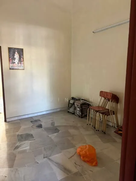 Room features: cream painted walls, marble flooring, single wall-mounted shelf, two wooden chairs, small storage bag, framed artwork on wall.