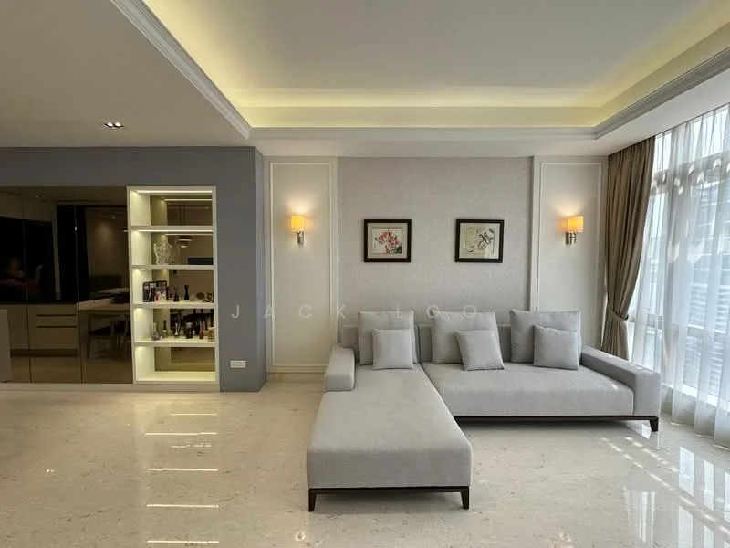 Living features: L-shape sectional sofa in light grey, marble flooring, recessed downlights, wall-mounted artwork, wall sconces, floor-to-ceiling windows with sheer curtains, built-in cabinetry with glass shelves, neutral painted walls, crown moulding, decorative ceiling with tray design; style: modern.