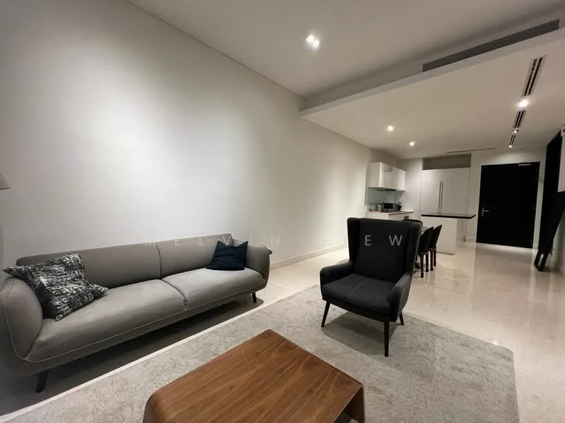 Living features: grey fabric 3-seater sofa, black armchair, wooden coffee table, cream area rug, white painted walls, recessed downlights, marble flooring, open layout to kitchen and dining area; style: modern.