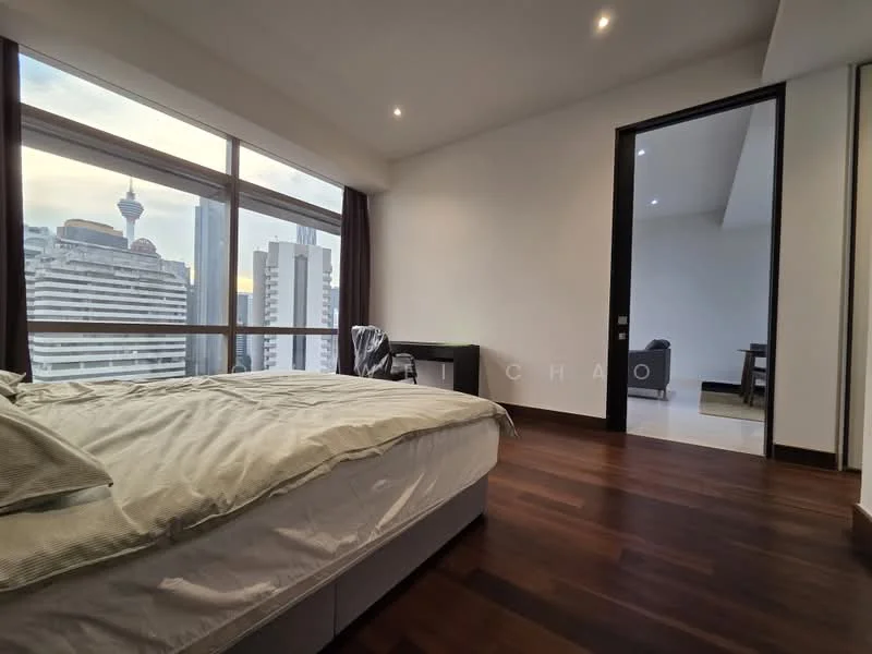 Bedroom features: king-size bed with light bedding, floor-to-ceiling windows, wooden flooring, white painted walls, recessed downlights, blackout curtains, study desk, chair, city skyline view; style: modern; view: city. Room features: white painted walls, light flooring.