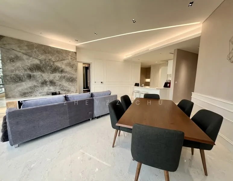 Living features: grey fabric sofa, marble flooring, feature wall with stone finish, recessed ceiling lights, dining table with wooden surface, black upholstered dining chairs, open layout, wall-mounted TV, white painted walls, kitchen area visible in background; style: modern.