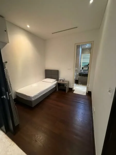 Bedroom features: single bed, grey upholstered headboard, wooden flooring, white painted walls, recessed downlights, nightstand, doorway to bathroom, closet with sliding doors; style: modern.