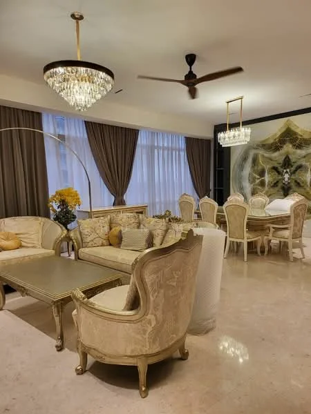 Living features: chandelier with crystals, 5-blade ceiling fan, cream upholstered sofa, gold accent pillows, gold-framed coffee table, decorative wall art, floor-to-ceiling windows with sheer curtains, cream marble flooring, golden armchair with intricate design, decorative plant in vase, dining area with wooden dining table, upholstered dining chairs; style: luxury.