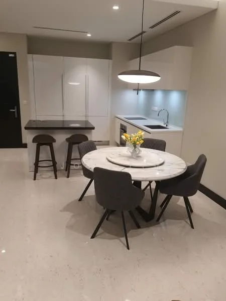Kitchen features: white cabinetry, marble dining table, 4 upholstered dining chairs, bar counter with 2 stools, stainless-steel sink, chrome pull-down faucet, built-in oven, induction hob, recessed downlights, polished tile flooring, grey walls, kitchen island; style: modern.