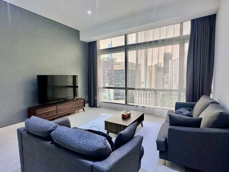 Living features: floor-to-ceiling windows, grey accent wall, light-colored flooring, 2-seater fabric sofa in grey, 3-seater fabric sofa in grey, wooden coffee table, TV console, wall-mounted TV, sheer curtains, decorative items on coffee table; style: modern; view: city.