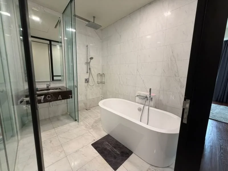 Bathroom features: freestanding bathtub, walk-in shower with glass enclosure, rain shower head, handheld shower, marble tile flooring, white marble wall tiles, double-sink vanity with wood cabinet, chrome basin mixer, framed mirror, towel rack, black bath mat; style: modern.