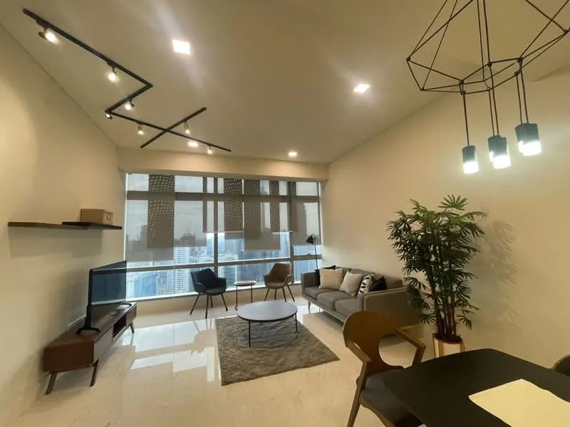 Living features: grey fabric sofa, round coffee table, area rug, wall-mounted TV, wooden TV console, floor-to-ceiling windows, sheer curtains, hanging pendant lights, decorative plant, dining table with chairs, recessed ceiling lights; style: modern; view: city.