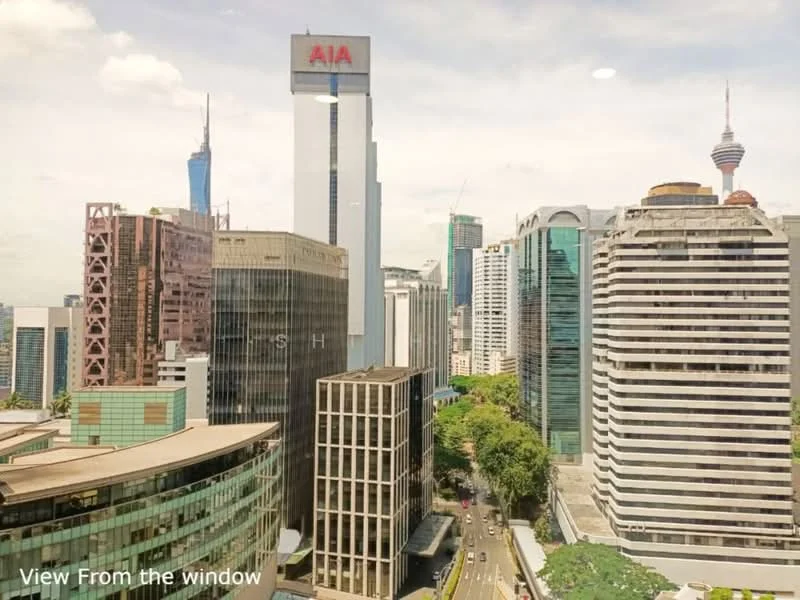 Exterior type: high-rise condominium; features: city skyline view, glass curtain wall, modern architectural design, surrounded by urban landscape, visible landmarks including AIA Tower and KL Tower; style: modern.