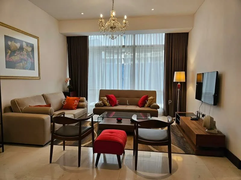 Living features: cream painted walls, marble flooring, chandelier, floor-to-ceiling windows, sheer curtains, 3-seater fabric sofa in beige, 2 accent chairs with wooden frames, glass coffee table, wood TV console, wall-mounted TV, decorative artwork, table lamp, area rug with geometric pattern; style: modern.