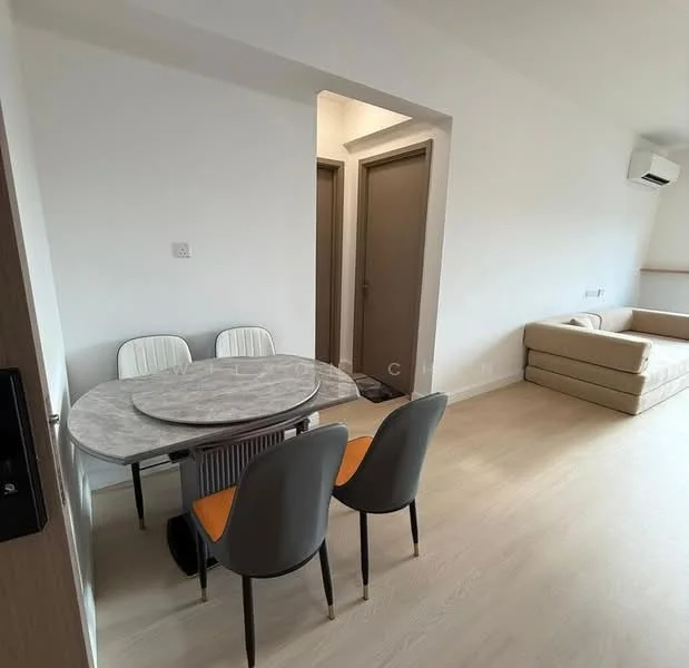 Dining features: round marble dining table, 4 dining chairs with grey upholstery and orange accents, light wood flooring, white painted walls, 1 wall-mounted split AC, doorway leading to hallway, doorway leading to another room, sofa in beige color visible in background; style: modern.