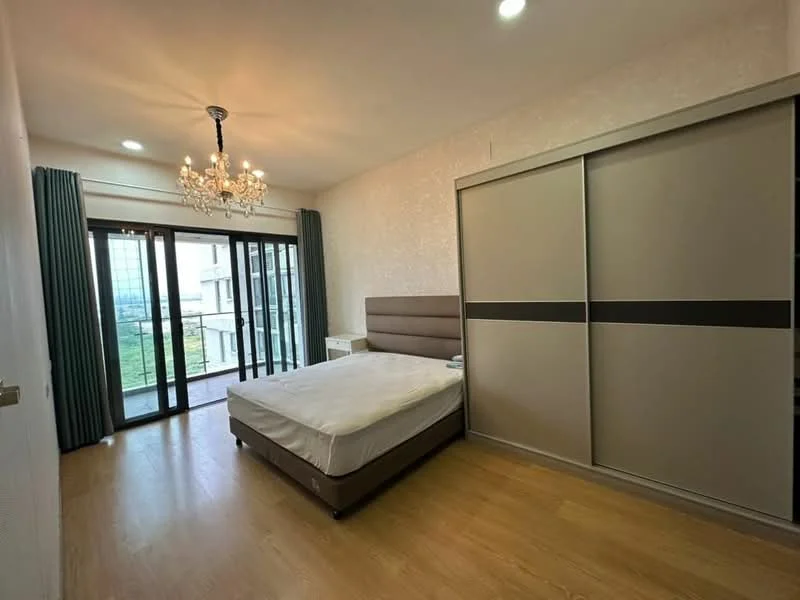 Bedroom features: king-size bed, upholstered headboard, built-in wardrobe with sliding doors, chandelier light fixture, floor-to-ceiling windows, sliding glass door to balcony, curtains, laminate flooring, decorative wallpaper, nightstand; style: modern; view: city.