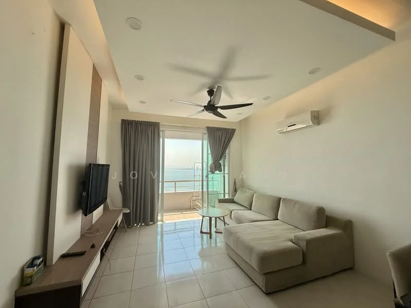 Living features: beige L-shape sectional sofa, glass coffee table, wall-mounted TV, wood TV console, 5-blade ceiling fan with light, recessed downlights, floor-to-ceiling windows, curtains, white painted walls, tile flooring, air conditioning unit; style: modern; view: sea.
