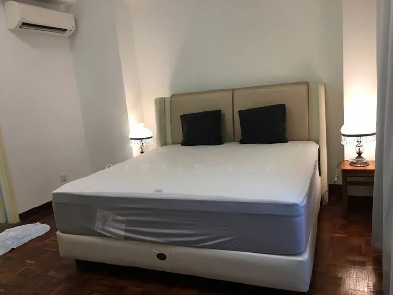Bedroom features: queen-size bed with upholstered headboard, 2 bedside lamps with decorative bases, wooden flooring, wall-mounted split AC, light-colored walls, dark wood nightstand, 2 dark throw pillows on bed, white bed linens; style: modern.