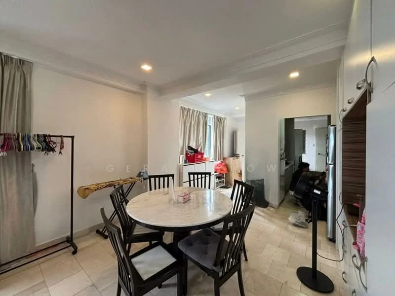 Dining features: round dining table with marble top, 4 black wooden dining chairs, white painted walls, tile flooring, recessed downlights, floor-to-ceiling window with sheer curtains, clothes rack, ironing board, fan, kitchen area visible in background; style: modern.