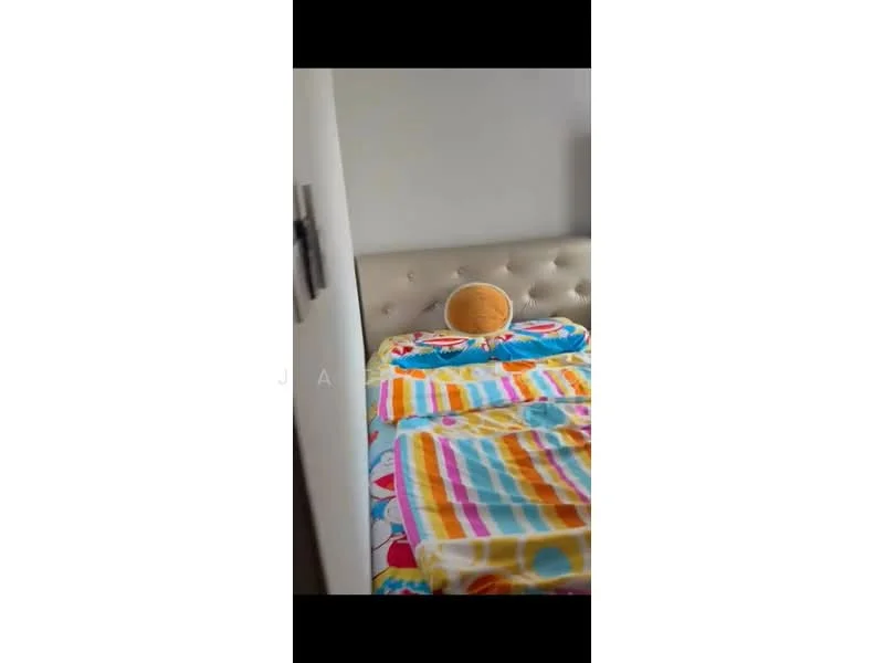 Bedroom features: queen-size bed with upholstered headboard, colorful striped bedding, decorative round pillow, light-colored walls, carpeted flooring, nightstand, wall-mounted light fixture; style: modern.
