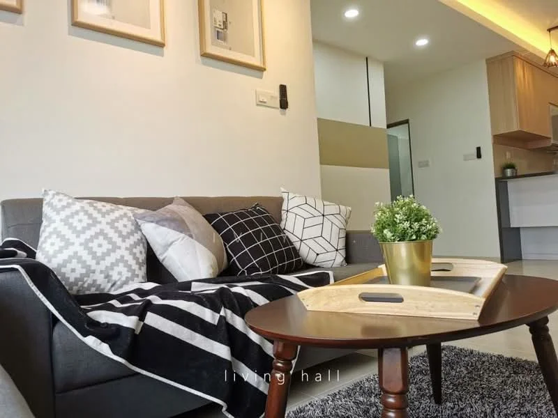 Living features: grey fabric sofa, black and white geometric throw pillows, black and white patterned throw blanket, wooden coffee table with handles, area rug with soft texture, recessed LED downlights, wall-mounted light switch, decorative potted plant, framed artwork on walls; style: modern.