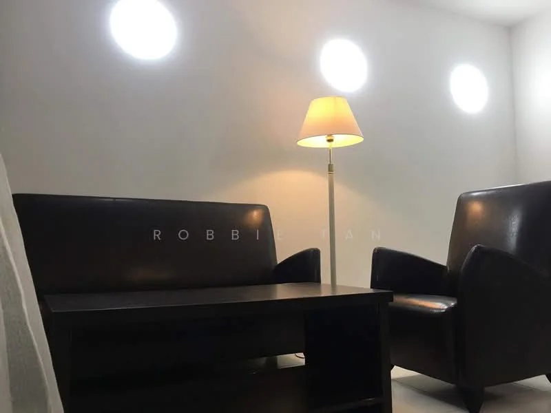 Room features: two black leather armchairs, wooden coffee table, floor lamp with white shade, white painted walls, round wall-mounted lights, light-colored flooring; style: modern.