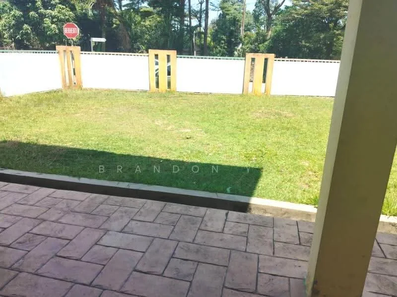 Exterior features: manicured lawn, paved walkway, white perimeter wall, stop sign visible, surrounded by trees, open outdoor space.