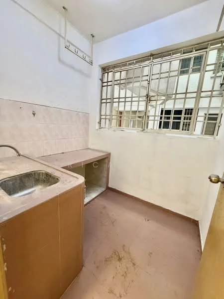 Room features: single-bowl stainless-steel sink, brown laminate countertop, white tiled backsplash, white painted walls, brown tiled flooring, metal window grilles, natural light from window, wall-mounted hooks.