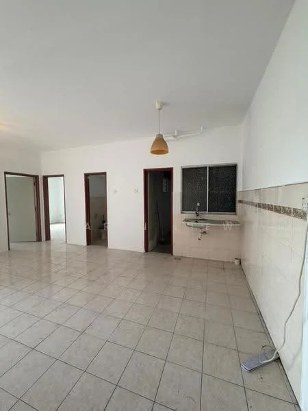 Room features: white painted walls, tile flooring, single ceiling light fixture, window with metal grille, kitchen sink, countertop, multiple doorways, open layout.