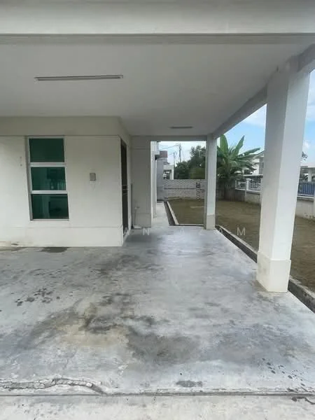 Exterior type: detached bungalow; features: concrete flooring, covered porch, green lawn, side pathway, exterior walls painted white, windows with green frames, surrounding landscaping with palm trees; style: modern.