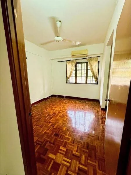 Room features: wooden flooring, white painted walls, ceiling fan, window with sheer curtains, air conditioning unit, door with handle, light switch, baseboard.