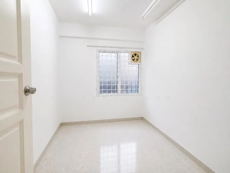 Room features: white painted walls, marble tile flooring, ceiling lights, window with security grille, wall-mounted fan, single door, neutral color scheme; style: minimalist.